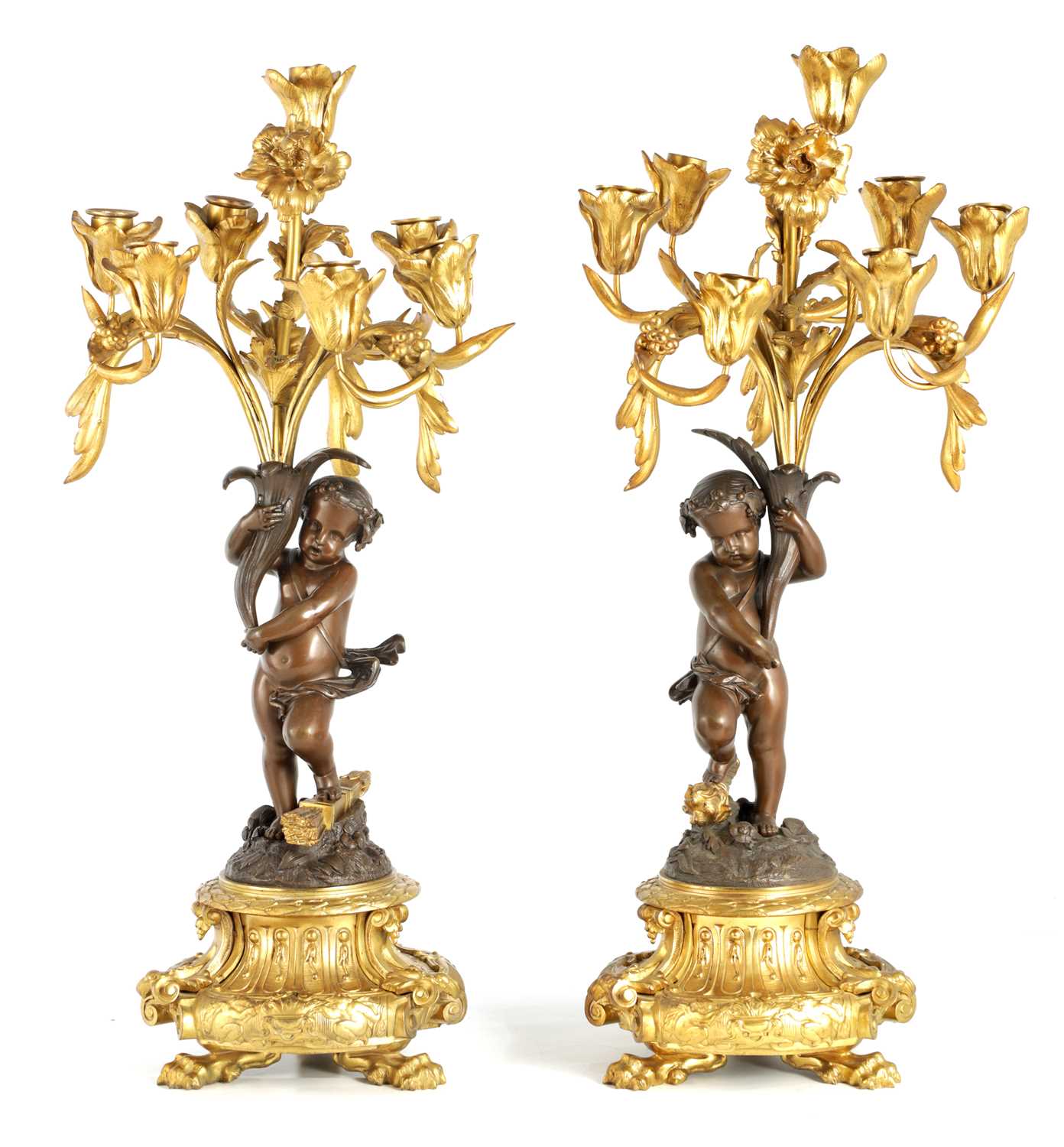 A PAIR OF 19TH CENTURY BRONZE AND ORMOLU SEVEN BRANCH CANDELABRA