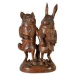 A LARGE AND RARE 19TH CENTURY BLACK FOREST CARVED LINDEN WOOD TOBACCO JAR FORMED AS A FOX AND HARE