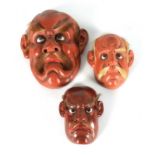 A GROUP OF THREE JAPANESE MEIJI PERIOD LACQUER WORK FACE MASKS