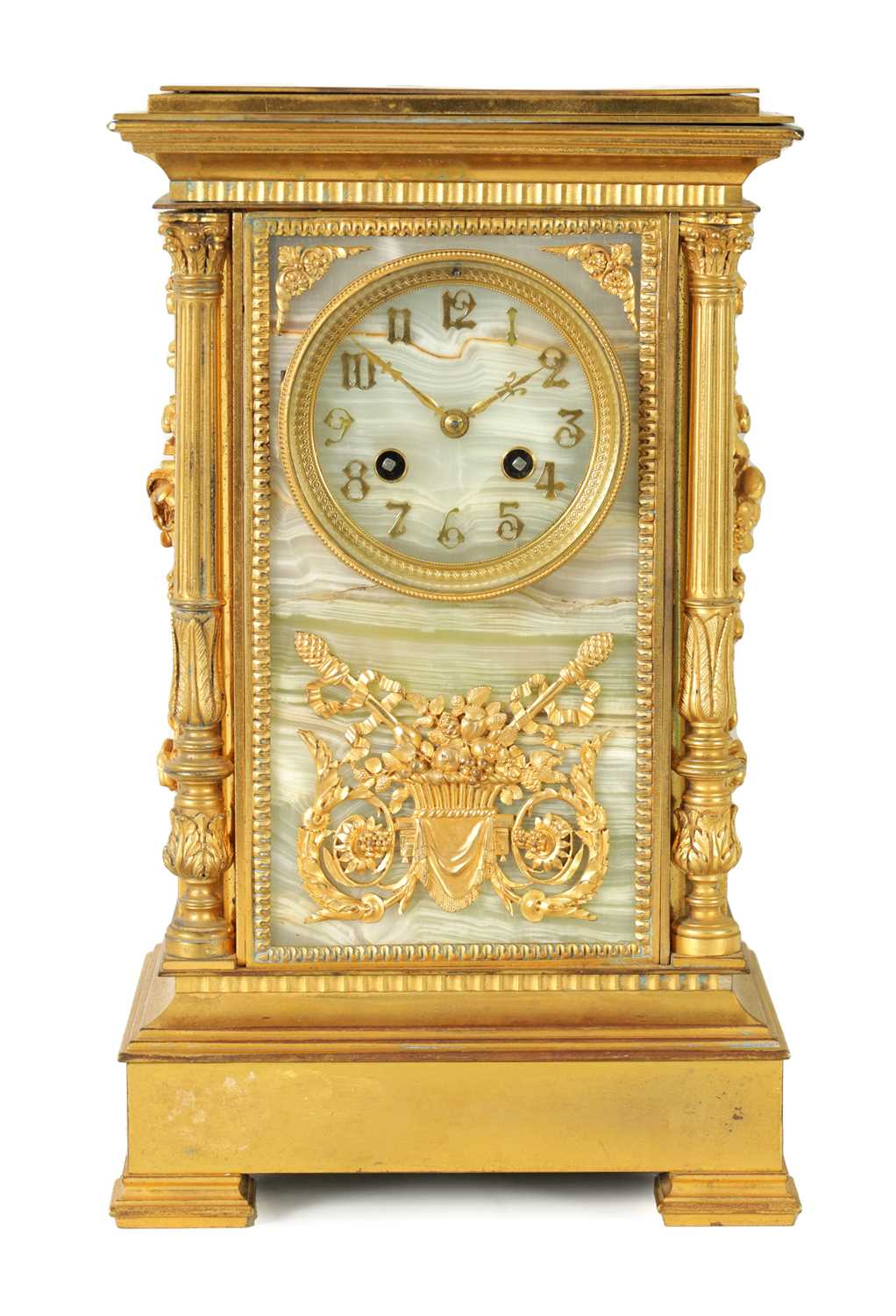 A 19TH CENTURY FRENCH ORMOLU AND ONYX PANELLED MANTEL CLOCK