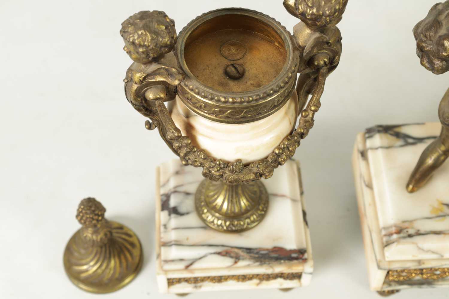 A LATE 19TH CENTURY ORMOLU AND VEINED MARBLE CLOCK GARNITURE - Image 6 of 13