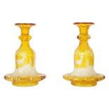 A FINE PAIR OF 19TH CENTURY BOHEMIAN AMBER FLASHED GLASS DECANTERS