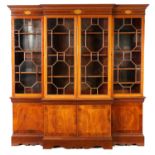 A LATE 19TH CENTURY INLAID MAHOGANY BREAKFRONT BOOKCASE