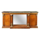 A GOOD REGENCY AMBOYNA AND GILTWOOD BREAKFRONT LIBRARY BOOKCASE
