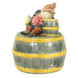 A COLOURFUL 19TH CENTURY CONTINENTAL MAJOLICA TOBACCO JAR/MATCH HOLDER