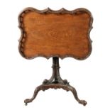 A FINE GEORGE III MAHOGANY TRIPOD TABLE IN THE MANNER OF THOMAS CHIPPENDALE