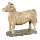 A 19TH CENTURY CARVED WOOD SCULPTURE OF A COW