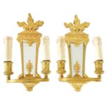 A PAIR OF ORMOLU REGENCY STYLE TWO BRANCH WALL LIGHTS