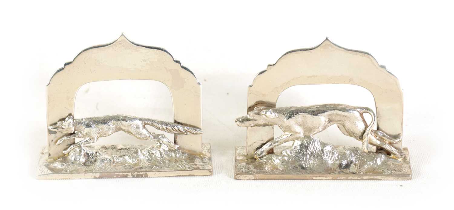 A PAIR OF SILVER MENU HOLDERS MODELLED AS FOX AND HOUND