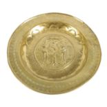 A 16TH CENTURY NUREMBERG BRASS ALMS DISH