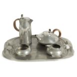 AN EARLY 20TH CENTURY ARCHIBALD KNOX FOR LIBERTY AND CO. TUDRIC PEWTER TEA SET