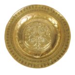 A 16TH CENTURY NUREMBERG BRASS ALMS DISH