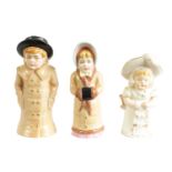 GIRL WITH MUFF AND BOY WITH BOATER. A PAIR OF ROYAL WORCESTER CANDLE EXTINGUISHERS