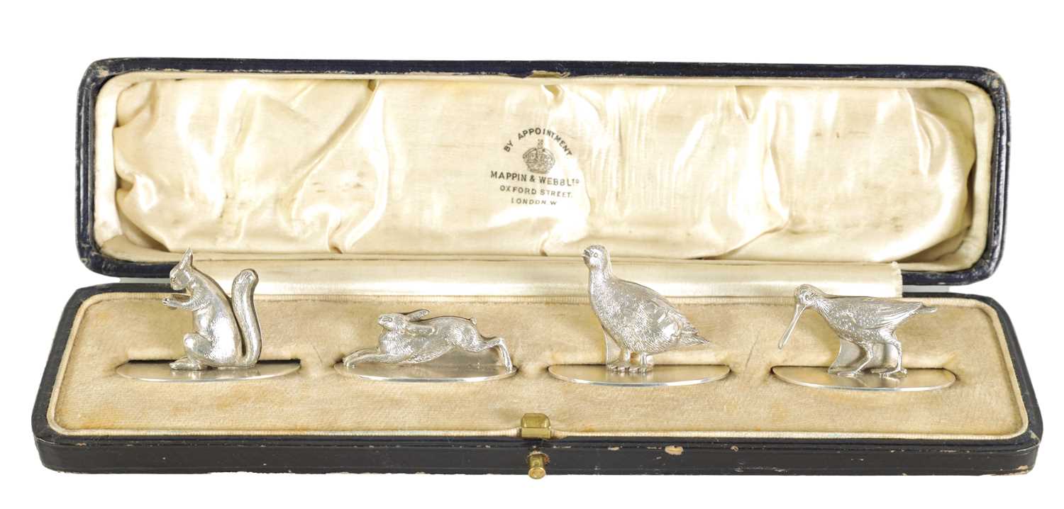 A CASED SET OF FOUR SILVER ANIMALIER MENU HOLDERS
