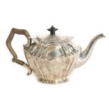 A LATE VICTORIAN SILVER TEAPOT