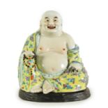 AN EARLY 20TH CENTURY CHINESE FAMILLE ROSE PORCELAIN BUDDHA