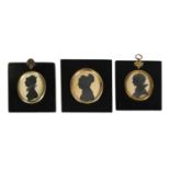 THREE EARLY/MID 19TH CENTURY SILHOUETTE BUST PORTRAITS ON CARD OF YOUNG LADIES