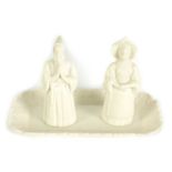 MONK AND NUN ON TRAY. A PARIAN MINTON GROUP OF CANDLE EXTINGUISHERS