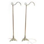 A PAIR OF EARLY 20TH CENTURY PATINATED BRASS OFFICER'S STANDARD LAMPS