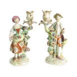 A PAIR OF 19TH CENTURY DERBY FIGURAL CANDLESTICKS