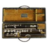 A 19TH CENTURY WOOD FLUTE AND PICCOLO BY RUDALL, CARTE & CO. LTD.