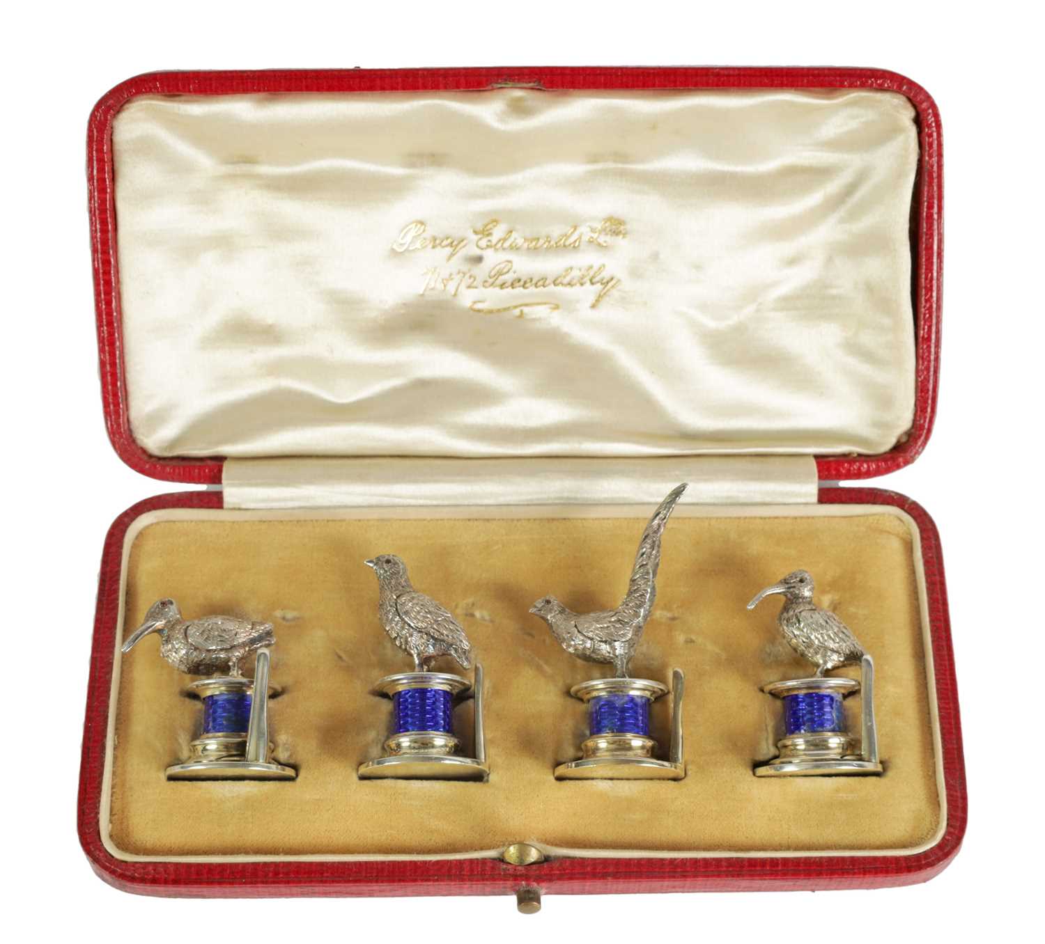 A CASED SET OF FOUR SILVER AND GUILLOCHE ENAMEL GAME BIRD MENU HOLDERS