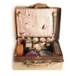 A VICTORIAN BROWN LEATHER PARTLY FITTED DRESSING CASE