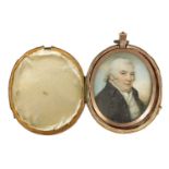 A GEORGE III OVAL MINIATURE BUST PORTRAIT ON IVORY OF JAMES SYME