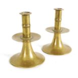 A RARE PAIR OF 17TH/18TH CENTURY ENGLISH BRASS TRUMPET CANDLE STICKS