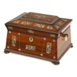 A LATE REGENCY ROSEWOOD AND MOTHER-OF-PEARL PANELLED INLAID SARCOPHAGUS SEWING BOX