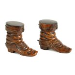 A PAIR OF 19TH CENTURY CARVED OLIVEWOOD BOOT INKWELLS