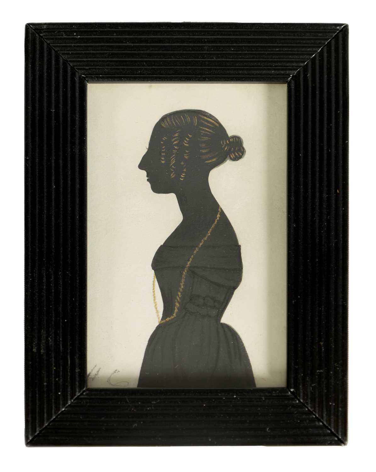 A 19TH CENTURY THREE QUARTER LENGTH SILHOUETTE PORTRAIT ON CARD