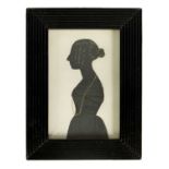 A 19TH CENTURY THREE QUARTER LENGTH SILHOUETTE PORTRAIT ON CARD