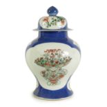 A 19TH CENTURY CHINESE POWDER BLUE GROUND FAMILLE VERTE VASE AND COVER