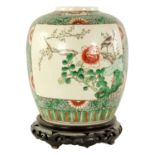 A 19TH CENTURY CHINESE FAMILLE VERTE GINGER JAR ON STAND