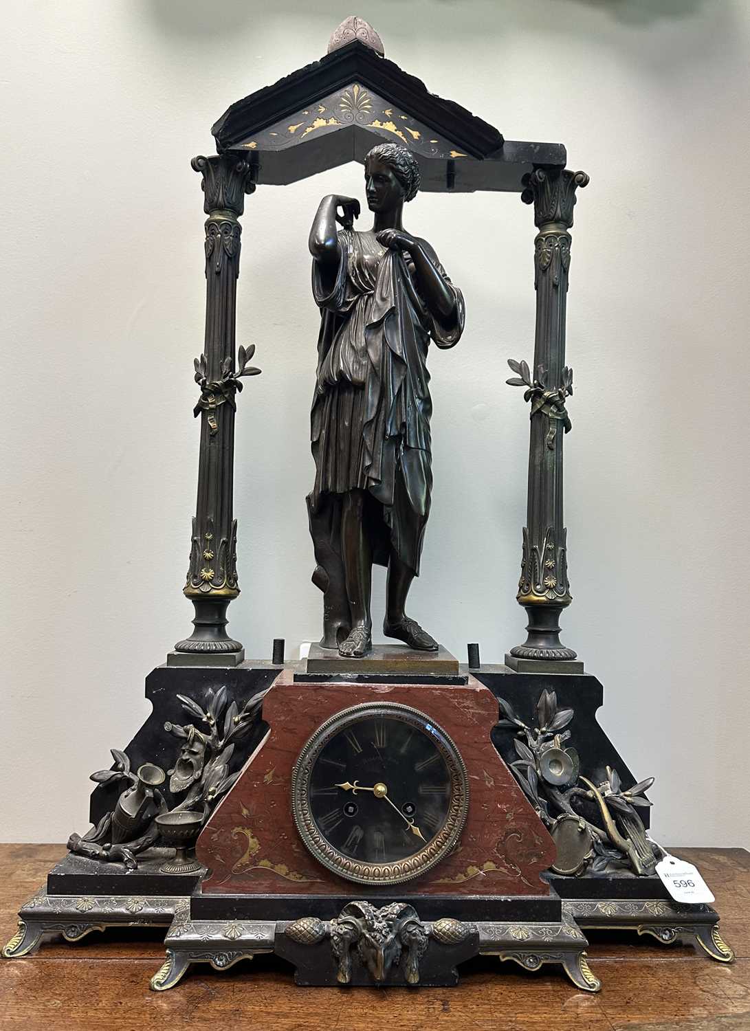 A LATE 19TH CENTURY FRENCH BLACK SLATE AND ROUGE MARBLE BRONZE FIGURAL MANTEL CLOCK