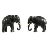 A PAIR OF LATE 19TH CENTURY INDIAN CARVED EBONY ELEPHANTS