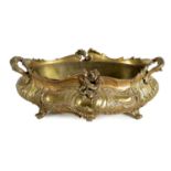 A 19TH CENTURY FRENCH CAST GILT METAL RECOCO STYLE OVAL TWO-HANDLED SHALLOW JARDINERE AND LINER