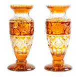A PAIR OF BOHEMIAN RED AND AMBER FLASHED CUT GLASS VASES