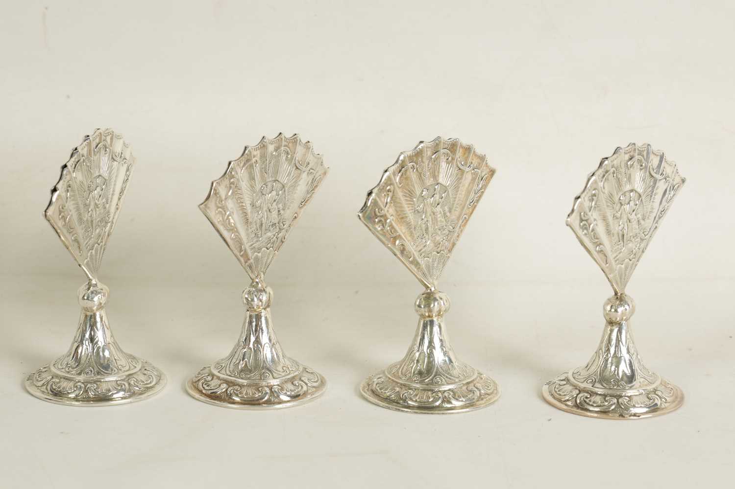 A CASED SET OF FOUR LATE VICTORIAN NOVELTY SILVER MENU HOLDERS MODELLED AS FANS - Image 9 of 11