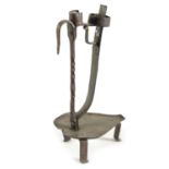 AN 18TH CENTURY IRON CANDLE HOLDER