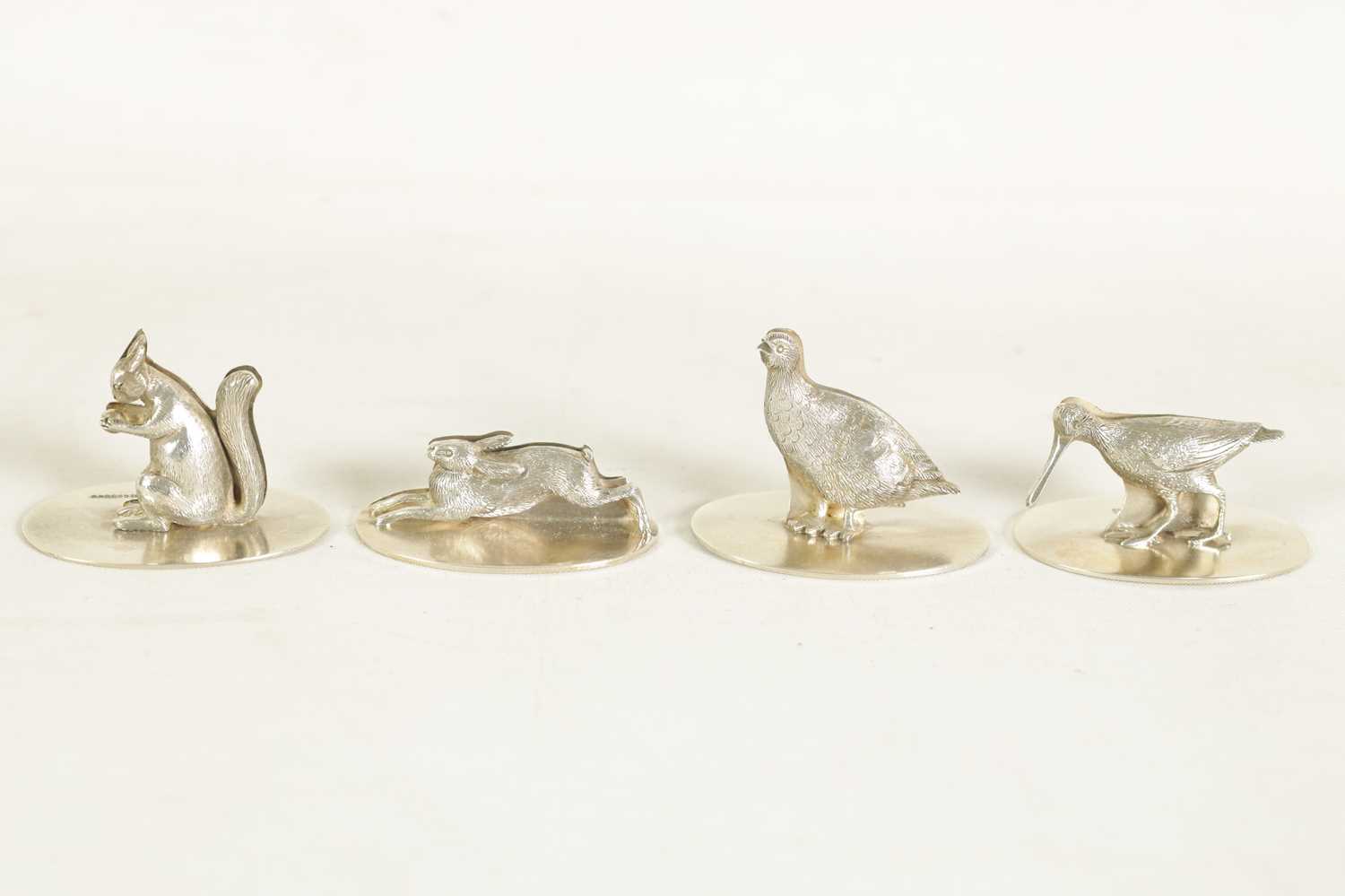 A CASED SET OF FOUR SILVER ANIMALIER MENU HOLDERS - Image 6 of 9