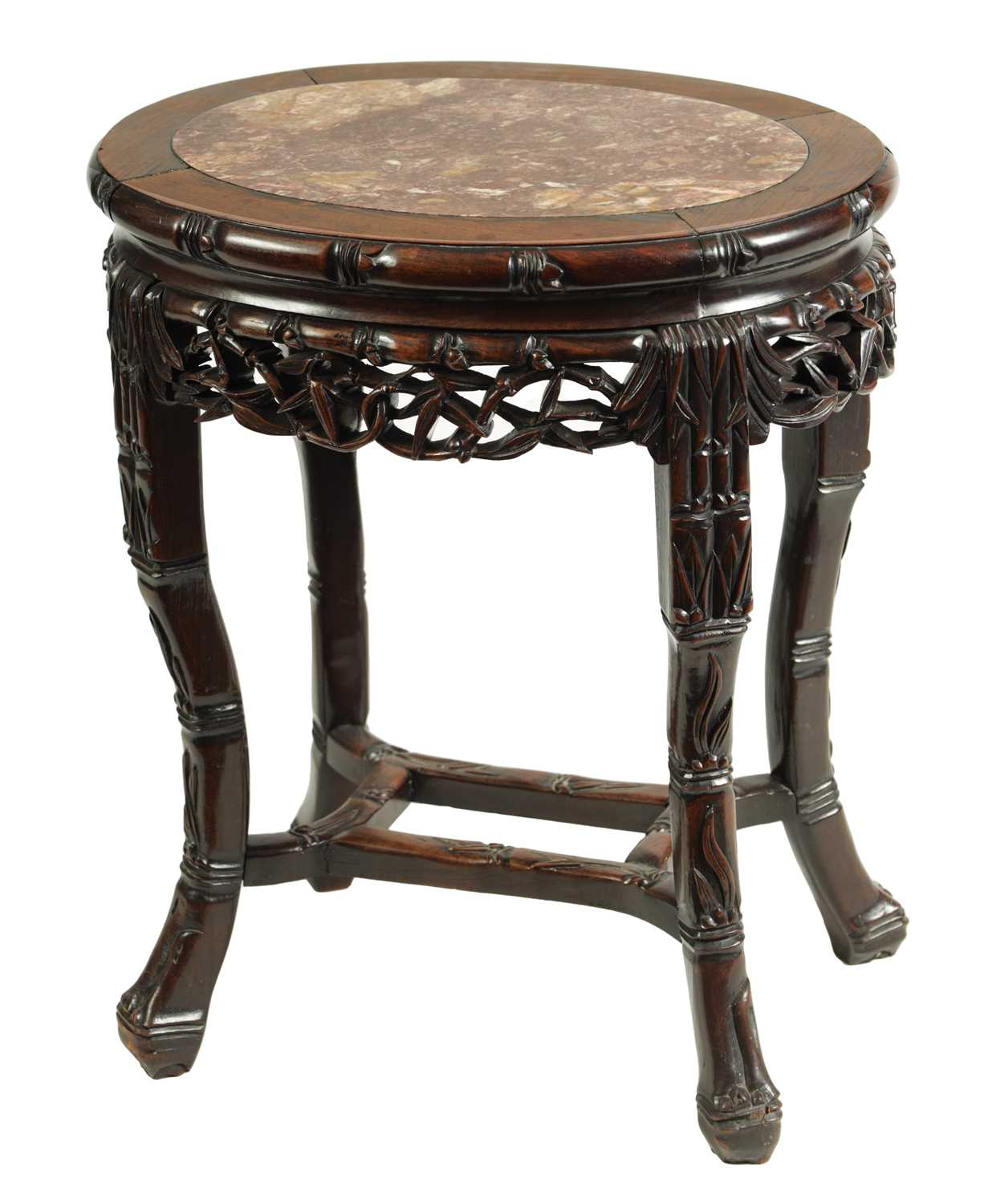 A 19TH CENTURY OVAL CARVED HARDWOOD CHINESE TABLE