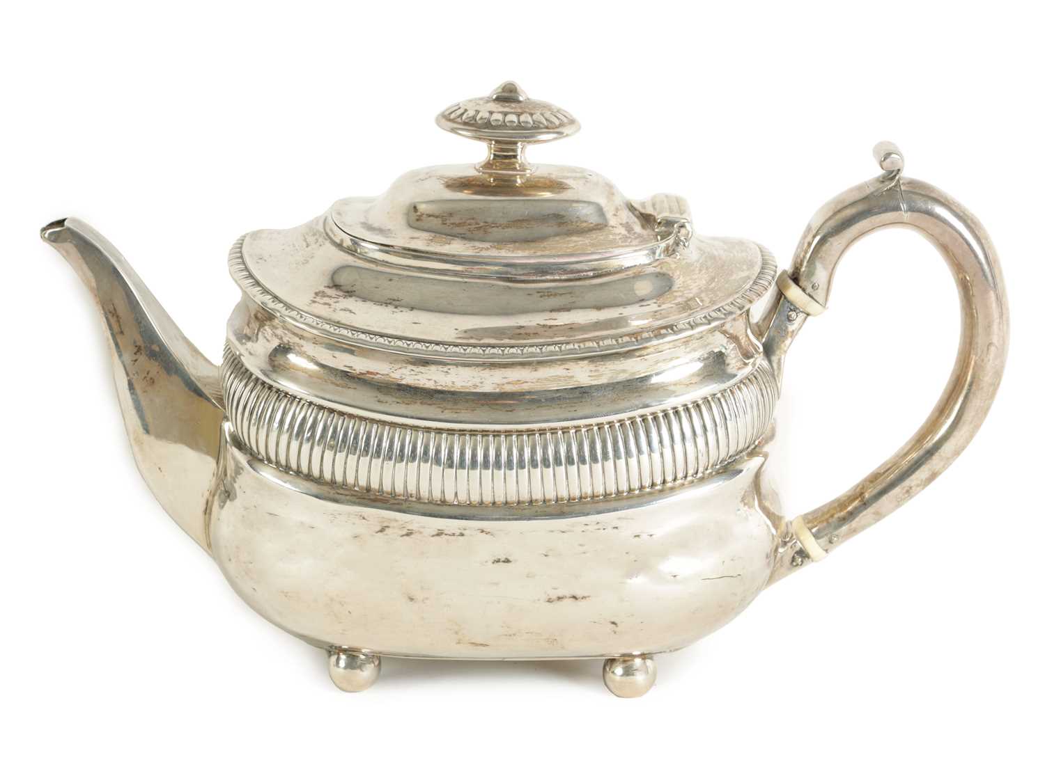 A GEORGE III SILVER TEAPOT