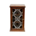 AN ART NOUVEAU OAK AND STAINED GLASS HANGING CUPBOARD