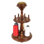 A 19TH CENTURY TURNED MAHOGANY BOBBIN STAND