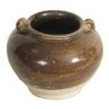 A CHINESE TANG PERIOD BROWN SLIPWARE POT