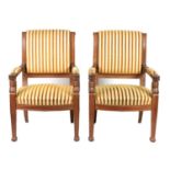 A PAIR OF REGENCY STYLE FRENCH MAHOGANY UPHOLSTERED ARMCHAIRS