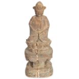 A CHINESE MING PERIOD CARVED WOODEN FIGURE OF AN IMMORTAL