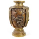 A JAPANESE MEIJI PERIOD BRONZE AND GILT BRONZE RELIEF MOULDED VASE